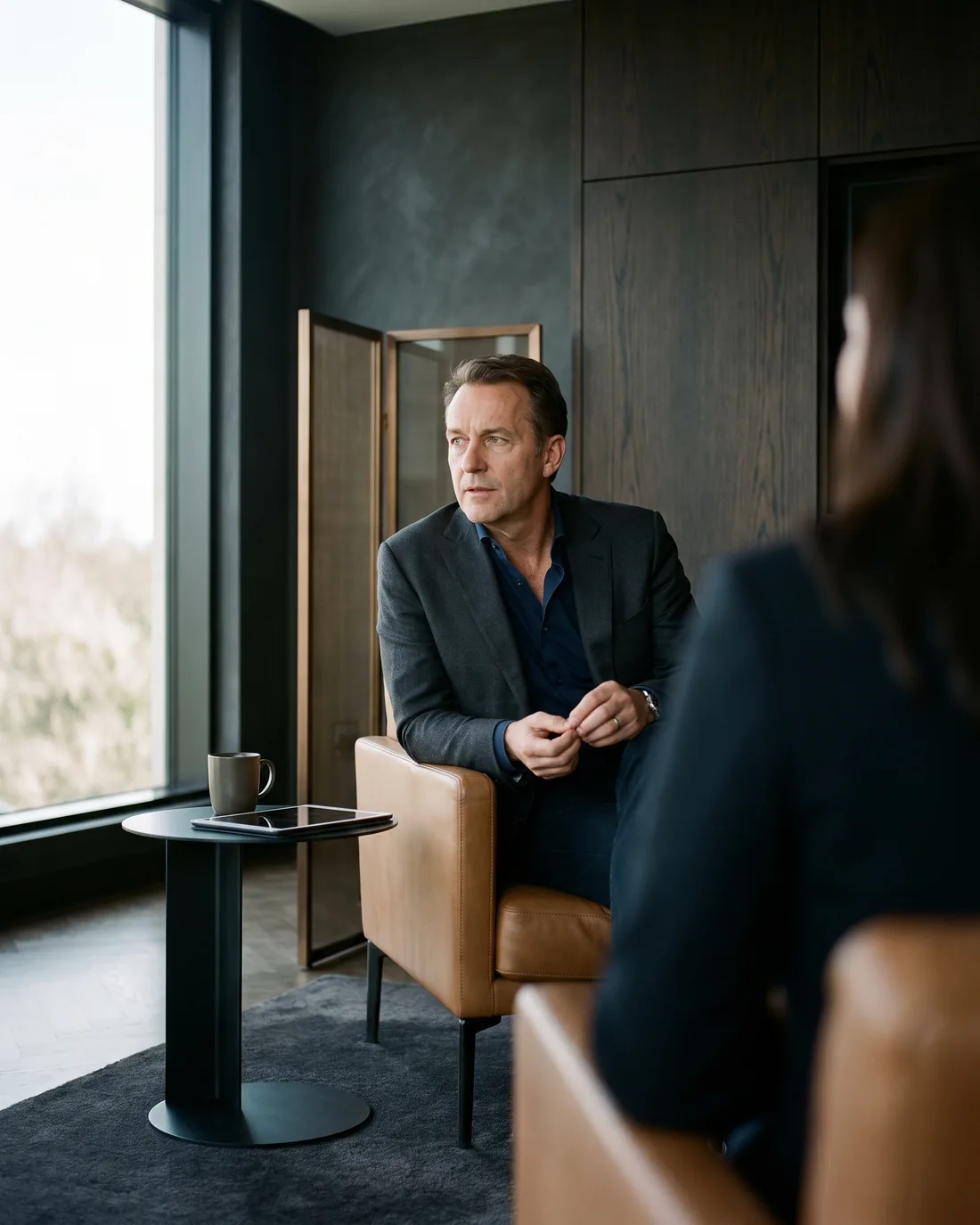A senior CHRO reviewing the work in a calm Atlanta boardroom